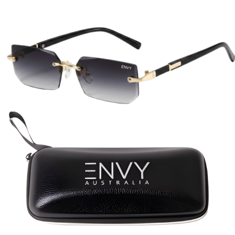 A pair of Shadow Gold rimless square sunglasses with gradient gray lenses and gold-tone metal hinges, shown above a black zippered hard case with the brand name ENVY AUSTRALIA printed in white. The sunglasses have black temples with gold accents.