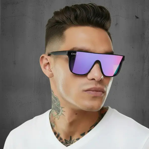 Man wearing a white shirt and sunglasses with a gray background