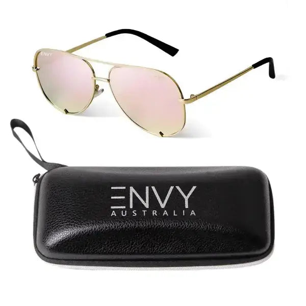 Gold-framed sunglasses with pink lenses and a black case on a white background, branded 'ENVY Australia'.